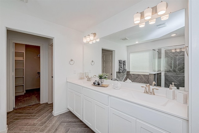 26234 Cooperstown Way, Splendora, TX 77372 - full bath with a walk in closet, visible vents, a sink, and a stall shower
