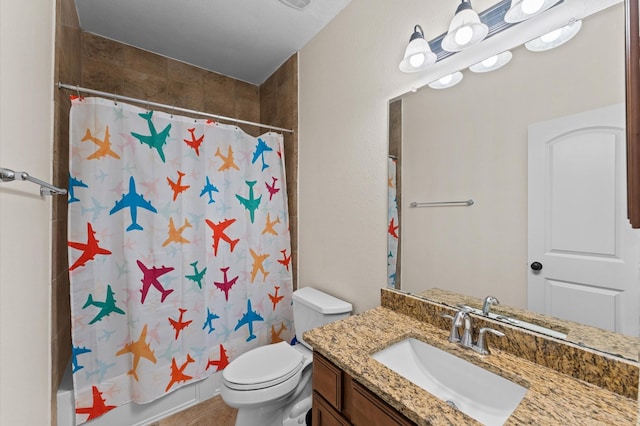 bathroom featuring vanity, shower / bathtub combination with curtain, and toilet