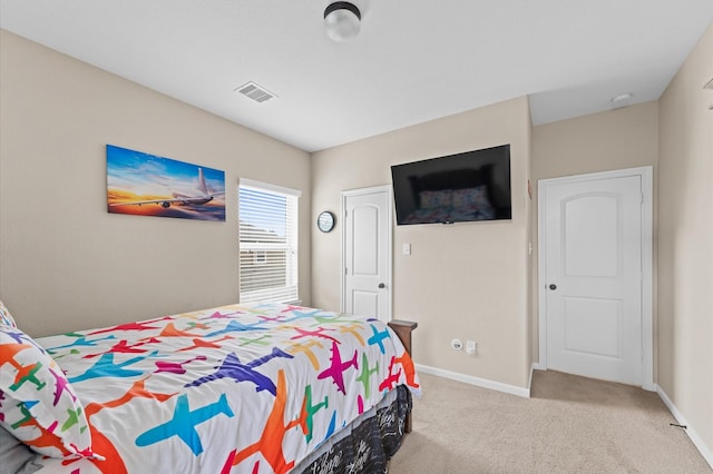 bedroom featuring baseboards, carpet, and visible vents