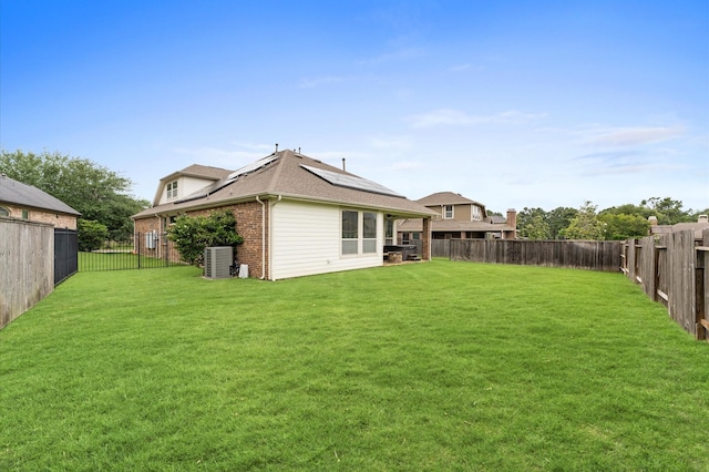view of yard featuring a fenced backyard and central air condition unit