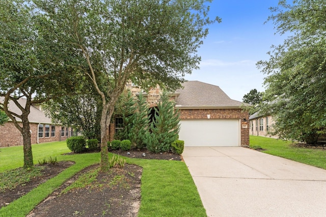 view of front of property with a shingled roof, a front lawn, brick siding, a garage, and concrete driveway