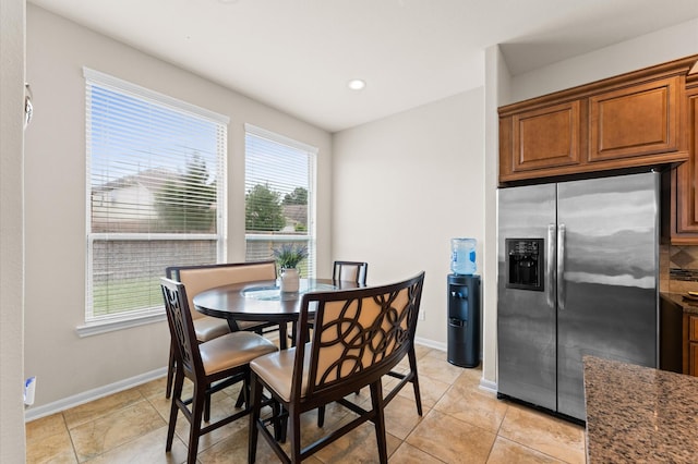 dining space featuring recessed lighting, baseboards, and a healthy amount of sunlight