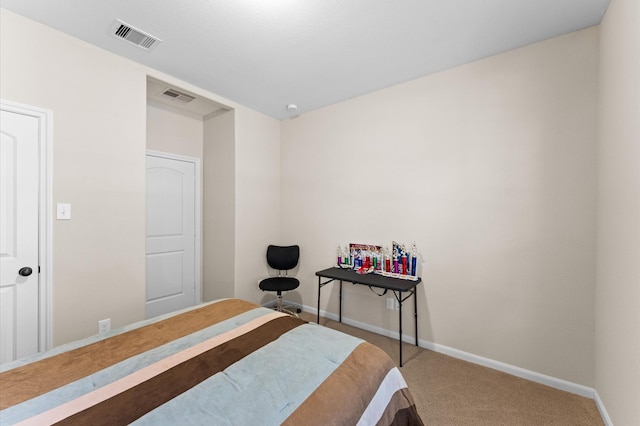 bedroom featuring baseboards, carpet, and visible vents