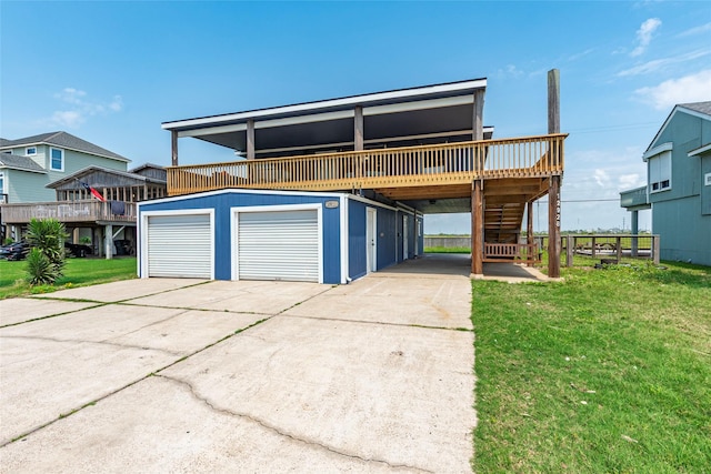 12928 John Reynolds Rd, Galveston, TX 77554 - view of front facade with a front yard, a deck, a garage, and stairs