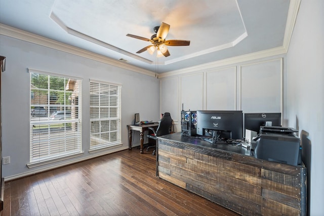 3011 Rustic Gardens Dr, Spring, TX 77386 - office featuring a tray ceiling, ceiling fan, dark wood-style flooring, and ornamental molding