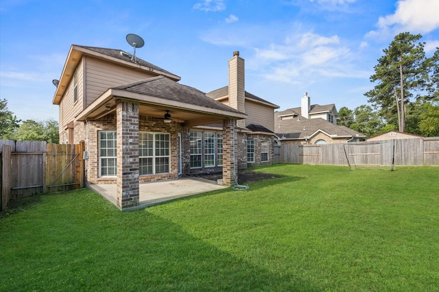 3011 Rustic Gardens Dr, Spring, TX 77386 - back of property with a ceiling fan, brick siding, and a patio