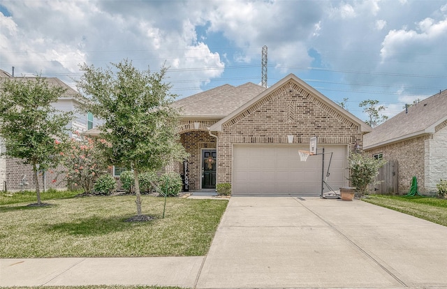 view of front of home featuring roof with shingles, an attached garage, a front lawn, brick siding, and concrete driveway