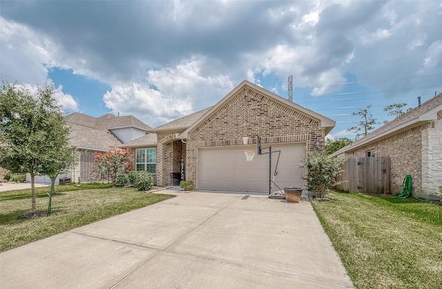ranch-style home with fence, a front lawn, brick siding, a garage, and driveway