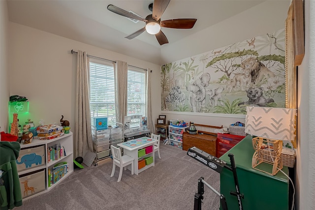 recreation room with carpet floors and ceiling fan