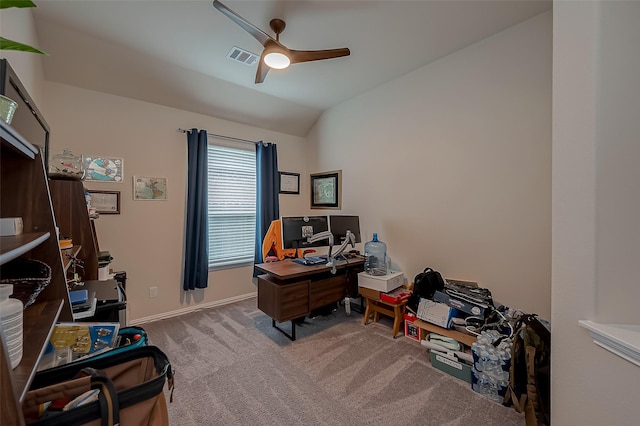 office area featuring ceiling fan, visible vents, vaulted ceiling, baseboards, and carpet