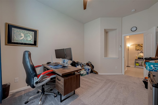 home office with carpet floors, ceiling fan, and baseboards