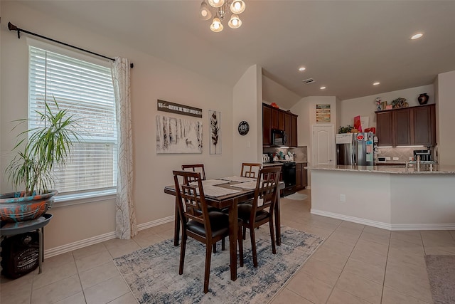 dining area with recessed lighting, baseboards, light tile patterned floors, lofted ceiling, and visible vents