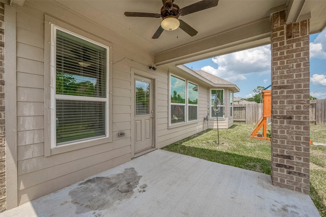 view of patio featuring a ceiling fan and fence