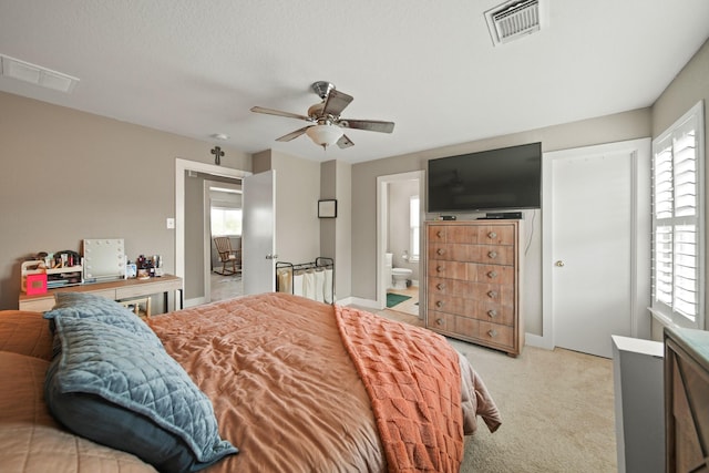 bedroom featuring visible vents and multiple windows