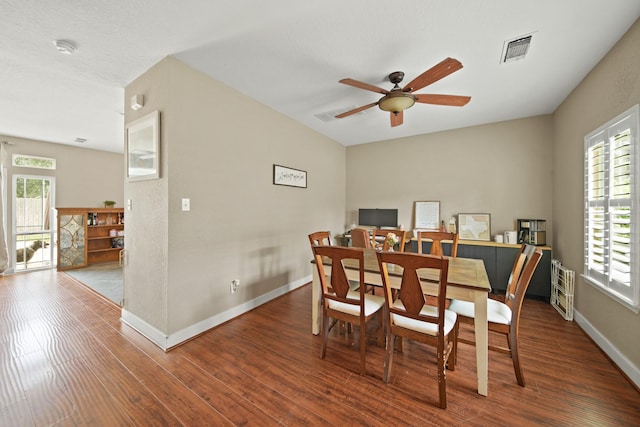 dining area with plenty of natural light, ceiling fan, wood finished floors, and visible vents