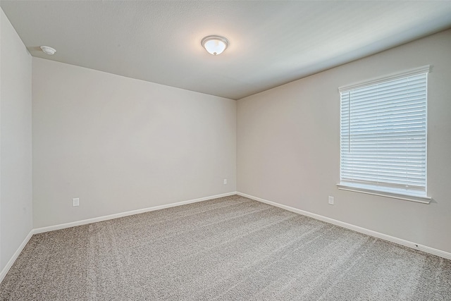 27083 Badger Way, Magnolia, TX 77354 - unfurnished room with carpet flooring and baseboards