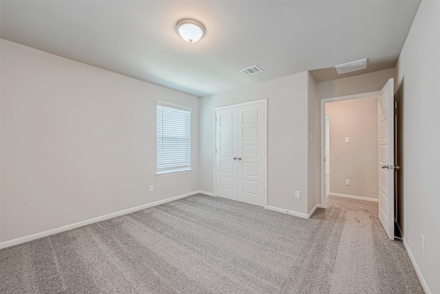 27083 Badger Way, Magnolia, TX 77354 - unfurnished bedroom featuring visible vents, carpet, baseboards, and a closet