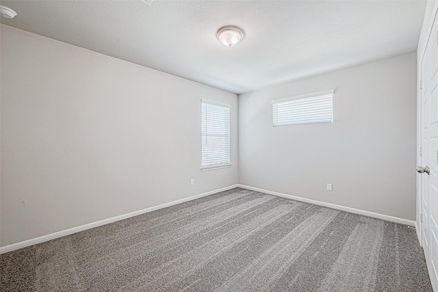 27083 Badger Way, Magnolia, TX 77354 - empty room featuring carpet floors and baseboards