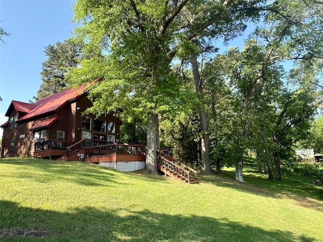 view of yard with stairway and a wooden deck