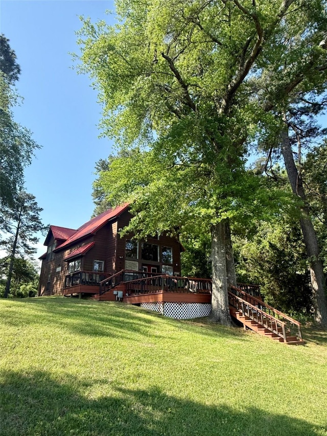 211 County Road 3119, Jacksonville, TX 75766 - view of green lawn with a deck