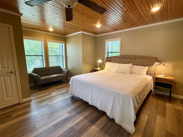 bedroom with wood ceiling, ceiling fan, crown molding, wood finished floors, and baseboards