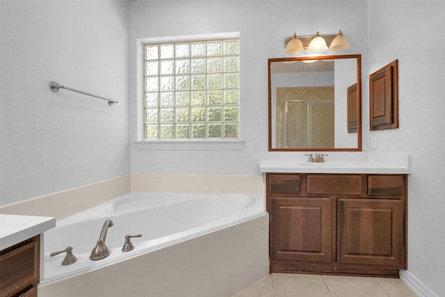 bathroom featuring vanity, a shower stall, tile patterned floors, and a bath