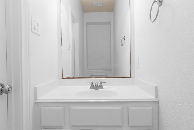 bathroom with visible vents and vanity