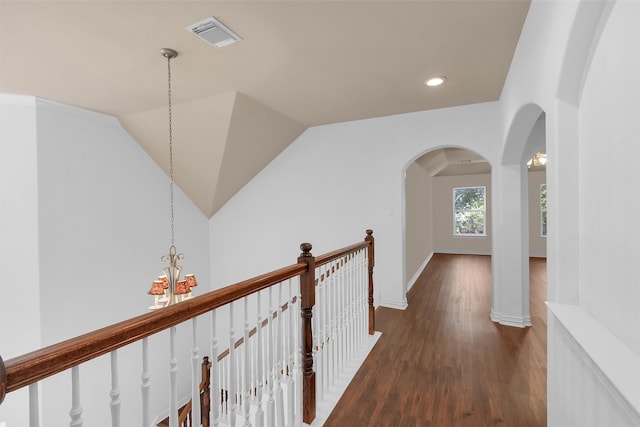 9019 Miller Rd, Magnolia, TX 77354 - hall featuring a chandelier, wood finished floors, arched walkways, recessed lighting, and baseboards