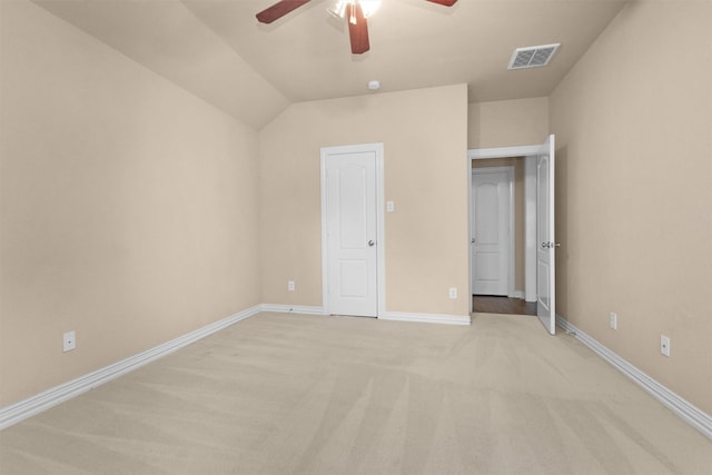 unfurnished bedroom featuring baseboards, ceiling fan, light carpet, and visible vents