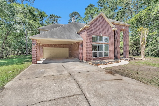 9019 Miller Rd, Magnolia, TX 77354 - traditional home with a front lawn, brick siding, an attached garage, roof with shingles, and concrete driveway