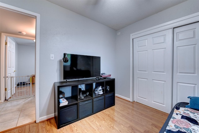 4114 Cicada Ln, Houston, TX 77039 - bedroom with baseboards, light wood finished floors, and a closet