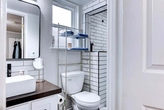 4114 Cicada Ln, Houston, TX 77039 - bathroom with crown molding, vanity, a textured wall, and toilet