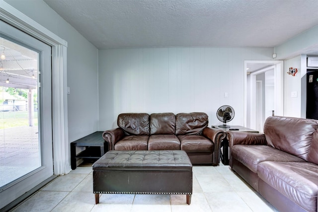 4114 Cicada Ln, Houston, TX 77039 - living area featuring light tile patterned floors and a textured ceiling