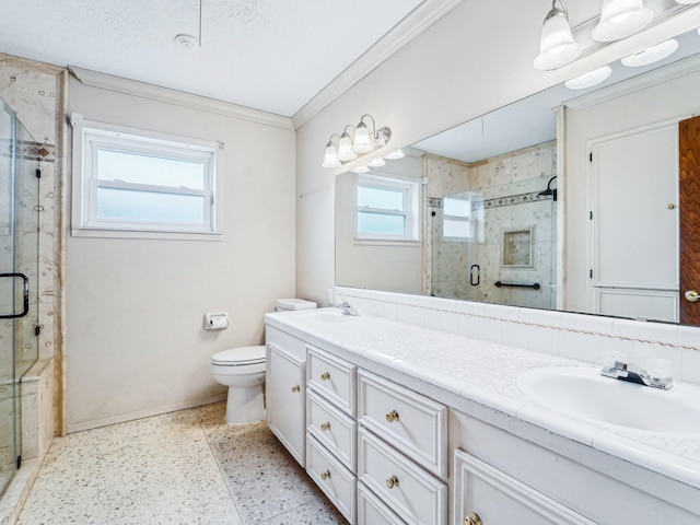 full bathroom featuring a stall shower, baseboards, toilet, a sink, and double vanity