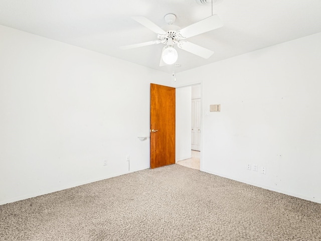 unfurnished room featuring light colored carpet and ceiling fan