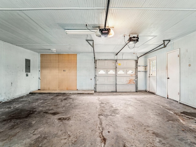 garage featuring electric panel and a garage door opener