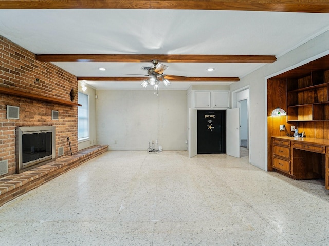 unfurnished living room featuring beam ceiling, light floors, a fireplace, ceiling fan, and baseboards