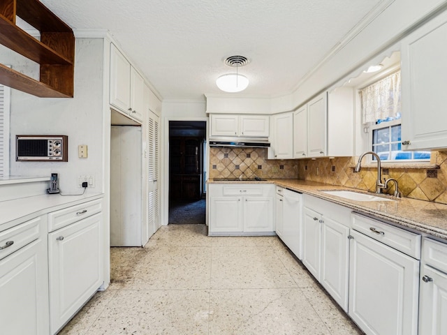 kitchen with a sink, crown molding, decorative backsplash, white dishwasher, and white cabinets