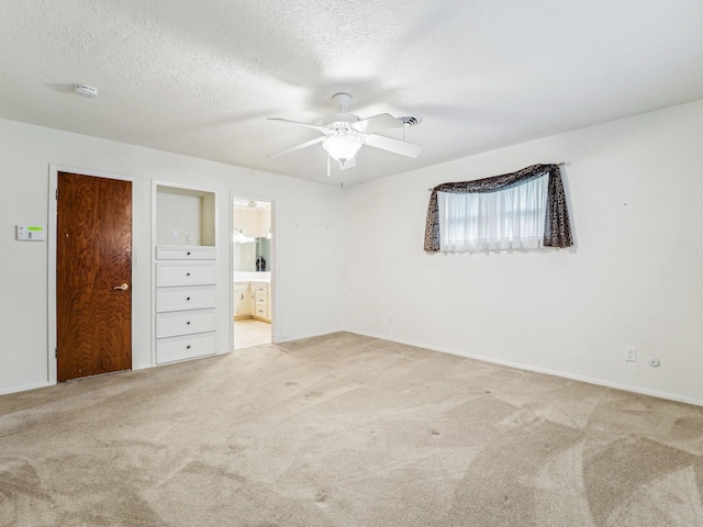 unfurnished bedroom with baseboards, a ceiling fan, and carpet floors