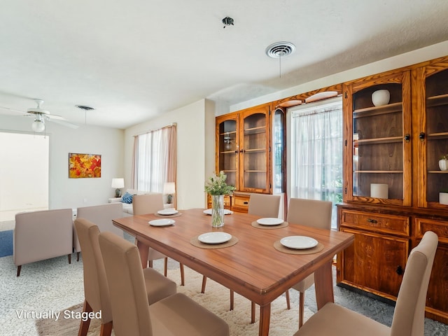 106 Faith St, Highlands, TX 77562 - dining area featuring a ceiling fan and carpet flooring