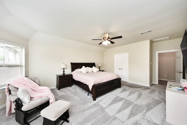 bedroom featuring baseboards and light colored carpet