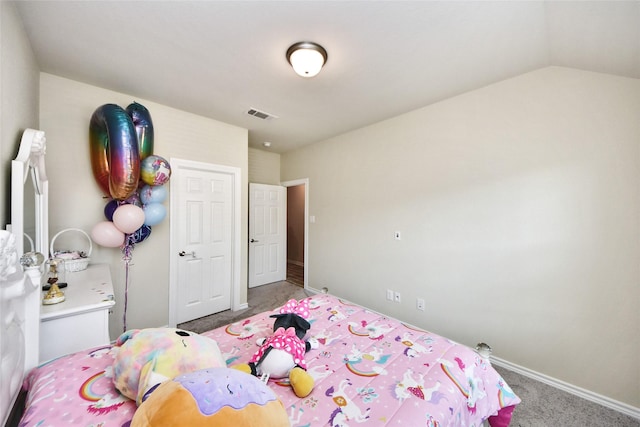 bedroom with carpet, baseboards, and vaulted ceiling