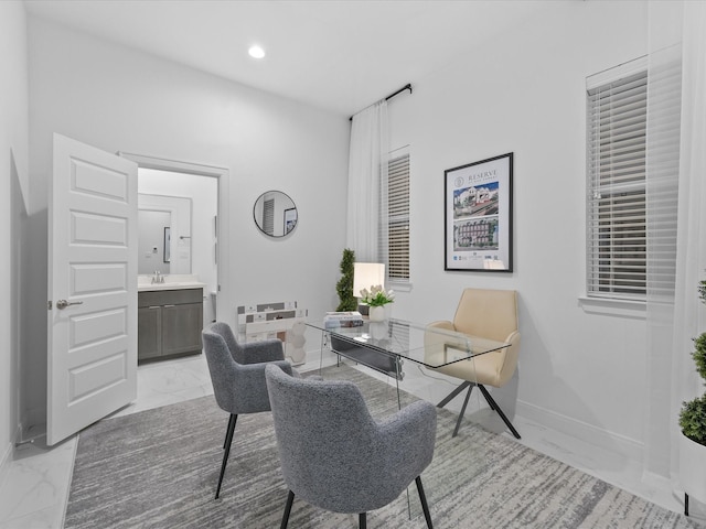 office area with baseboards, recessed lighting, marble finish floor, and a sink