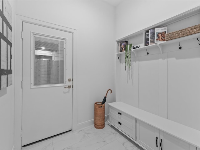 mudroom featuring baseboards and marble finish floor