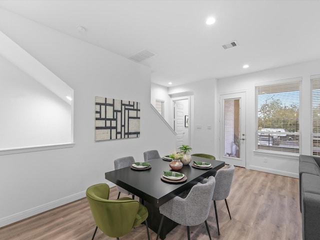 dining space with recessed lighting, baseboards, visible vents, and light wood-type flooring