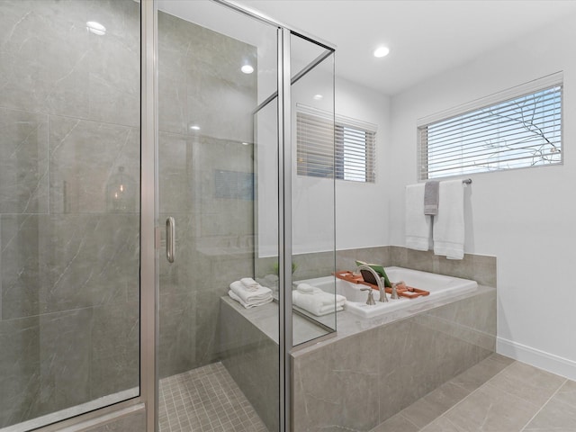 bathroom with a garden tub, tile patterned flooring, a stall shower, baseboards, and recessed lighting