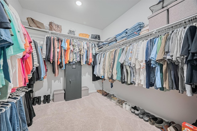 walk in closet featuring carpet