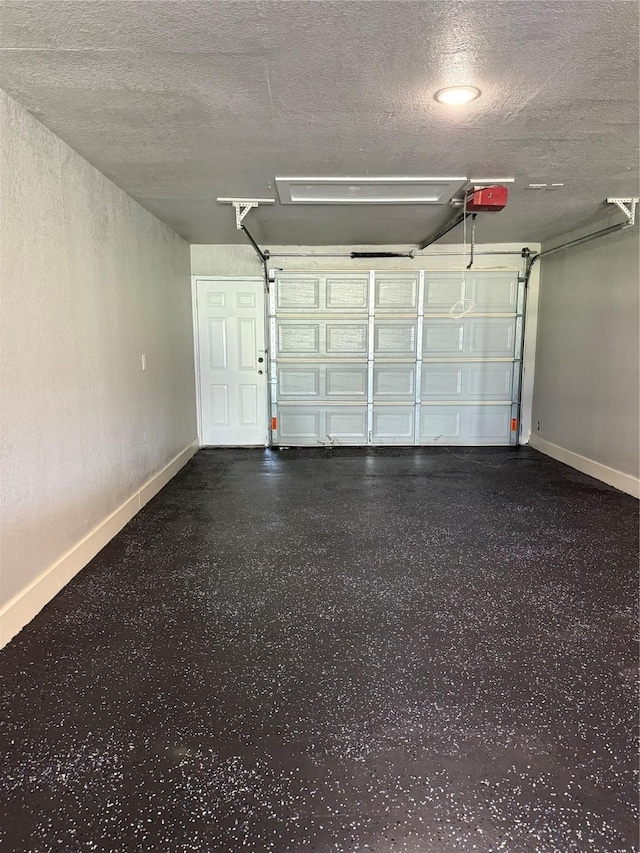 175 Heather Ln, Livingston, TX 77351 - garage featuring baseboards and a garage door opener