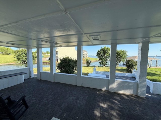 175 Heather Ln, Livingston, TX 77351 - unfurnished sunroom featuring a water view