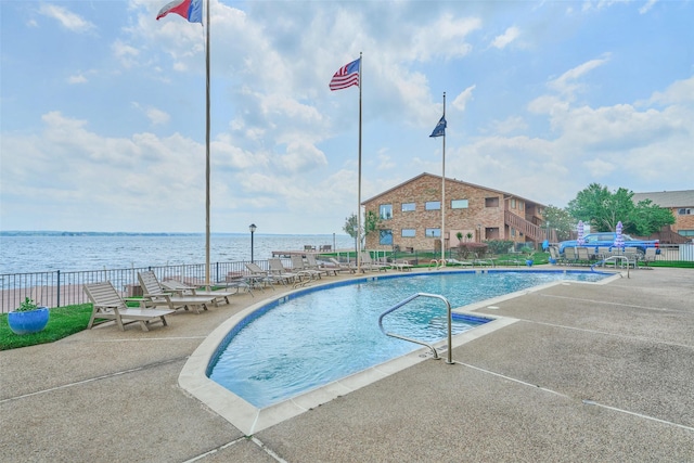 801 River Rd Unit 105D, Montgomery, TX 77356 - community pool with a water view, fence, and a patio area